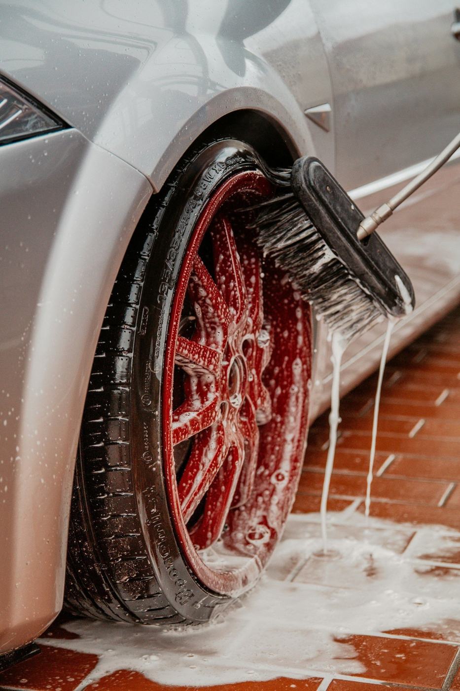 Soapy wheel being hand-detailed