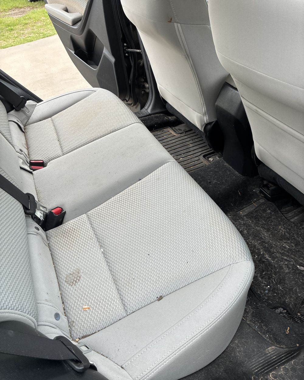 Before: Rear cloth seats before and after shampoo