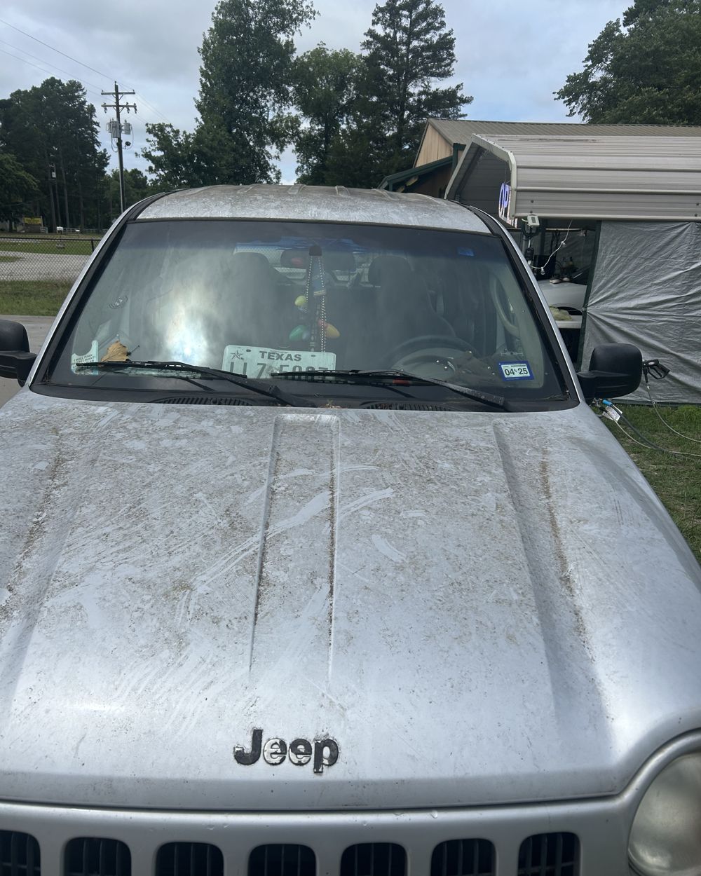 Before: Dusty Jeep hood before and after hand wash