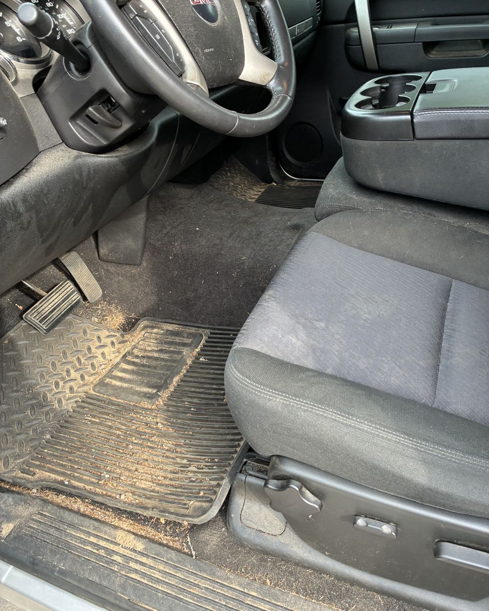 Before: Dirty truck footwell before and after vacuum and wipe-down