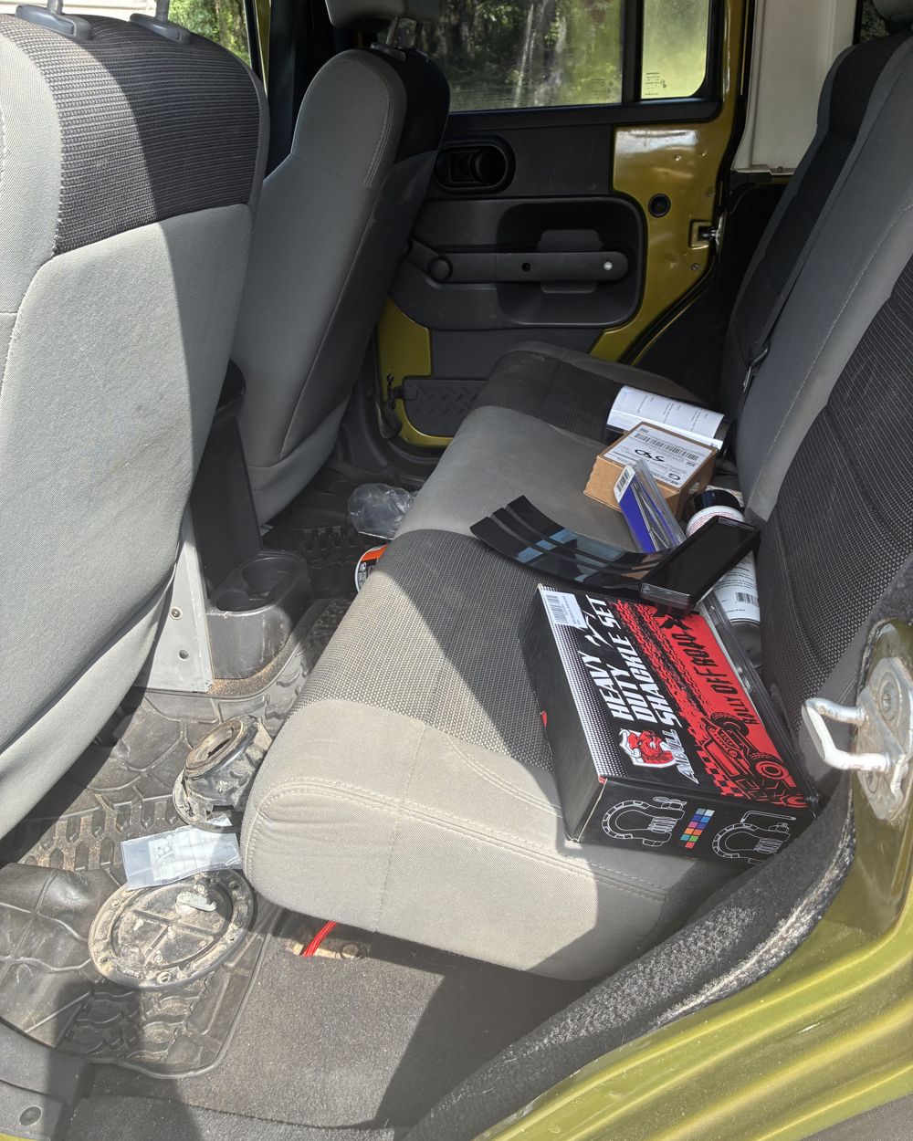 Before: Cluttered Jeep rear seat before and after interior detail