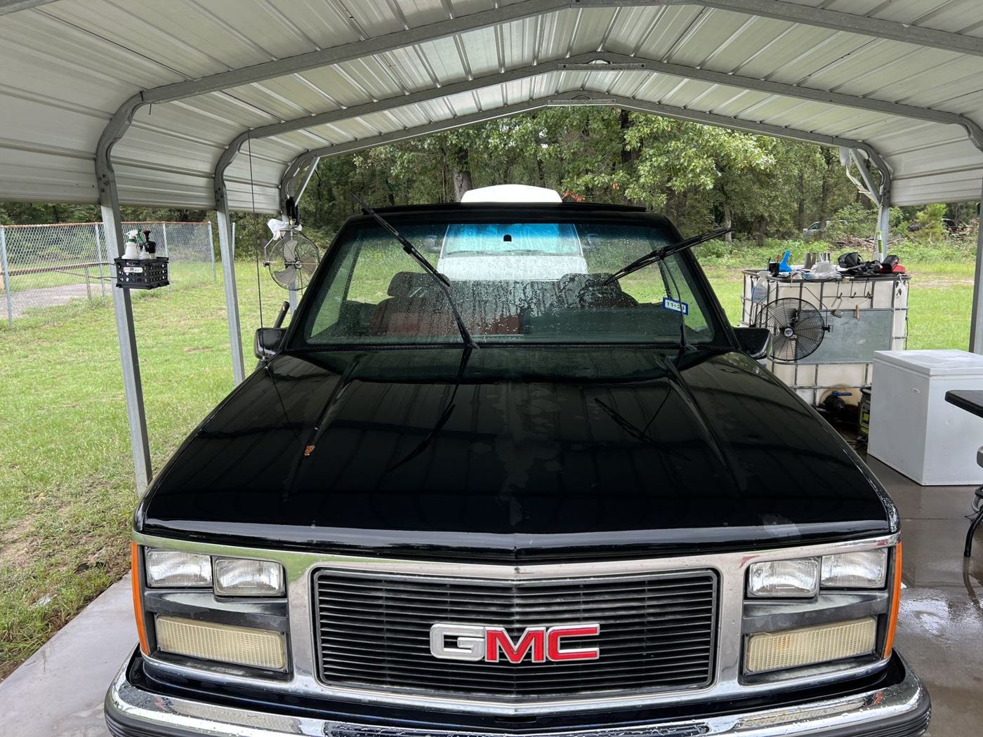 Classic black GMC Sierra pickup after detail