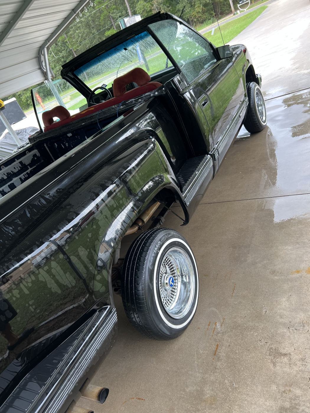 Wire wheels and whitewall tires detailed on a classic GMC