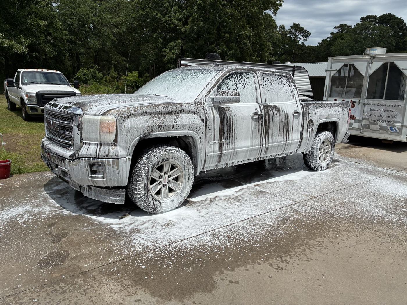 GMC Sierra in foam during hand wash