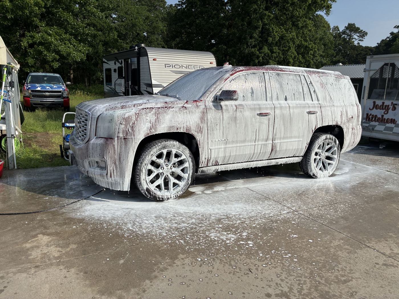 GMC Yukon covered in foam during hand wash