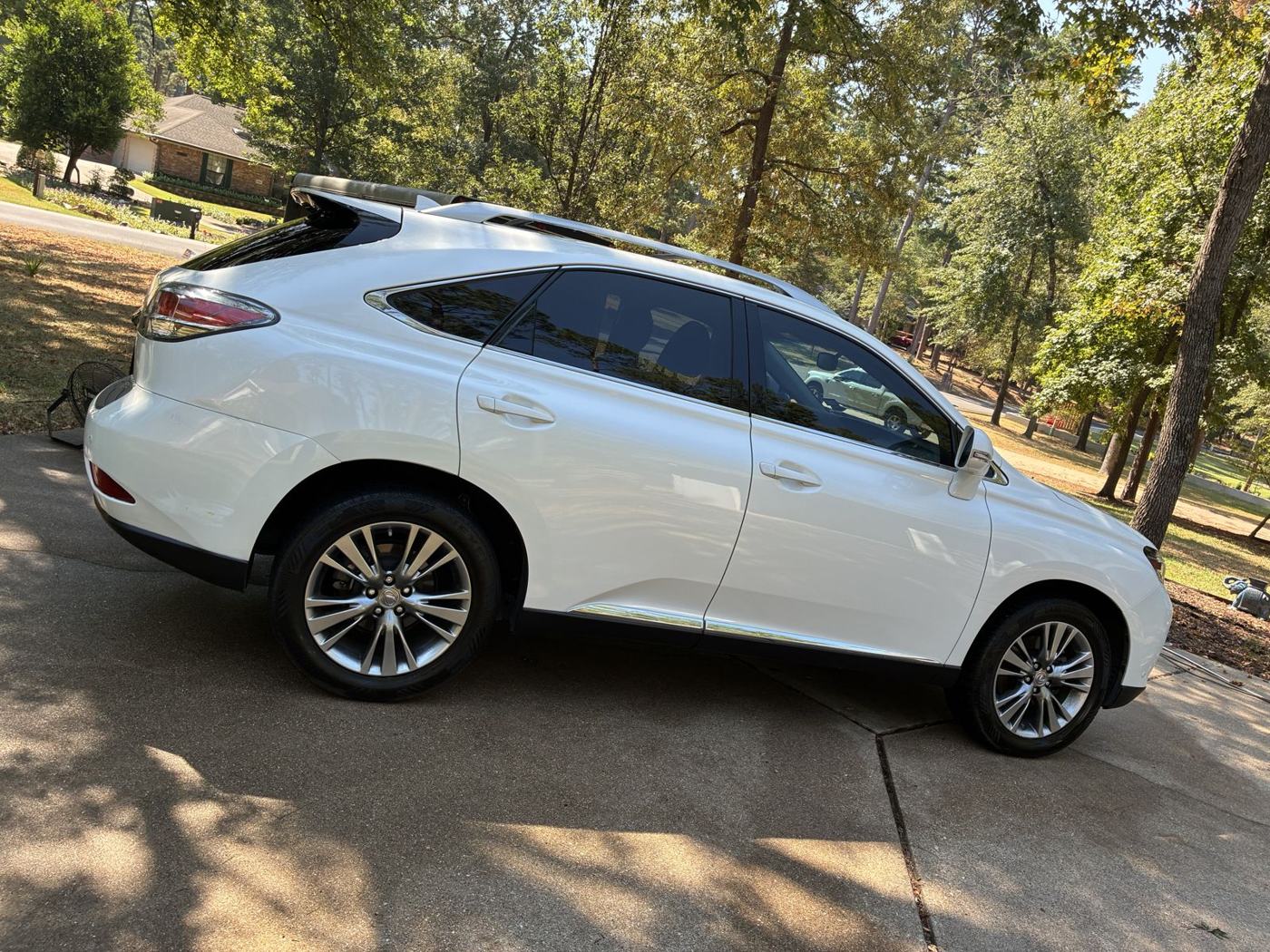White Lexus RX after mobile detail in a driveway