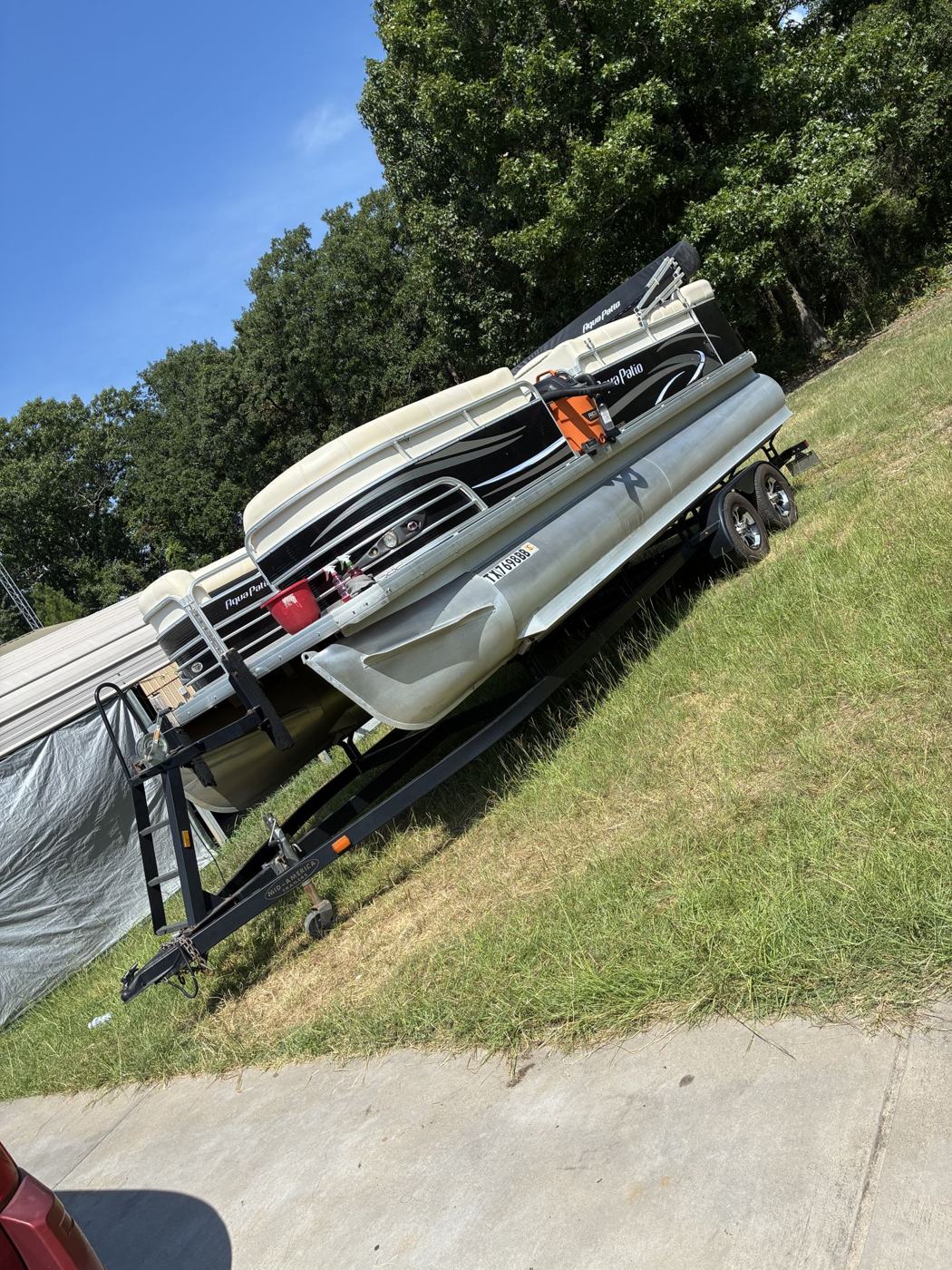 Pontoon boat on trailer after detail
